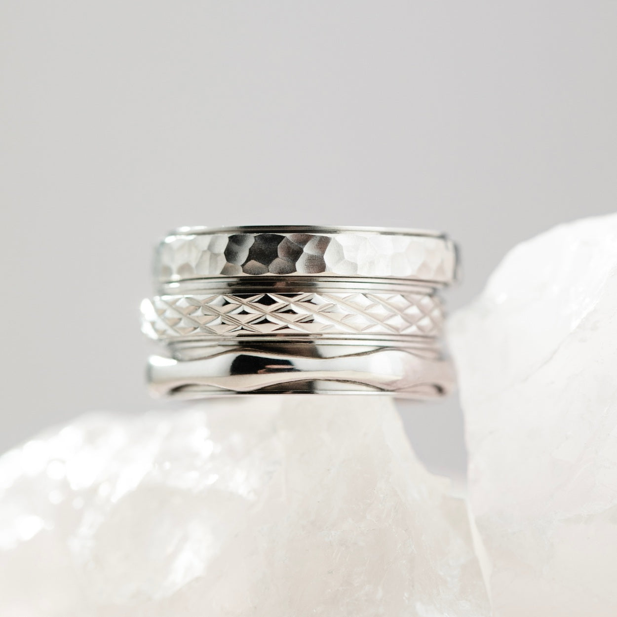 silver spinning cross pattern ring