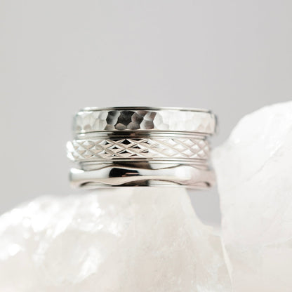 silver spinning cross pattern ring