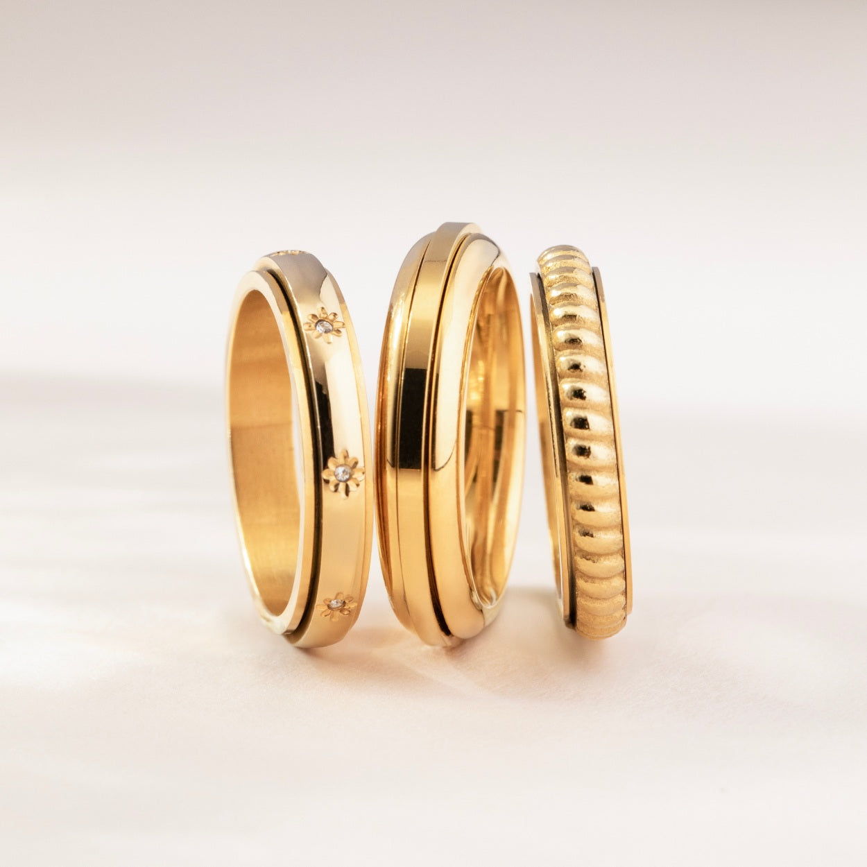 gold spinning star eternity band ring