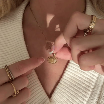 gold sphere-edged day and night spinning necklace